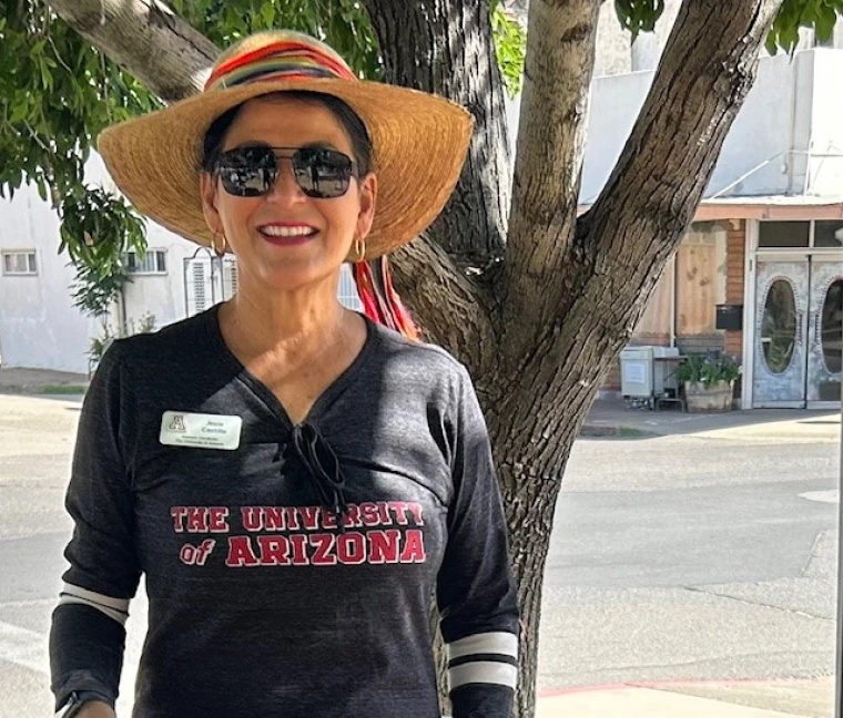 photo of a person in front of a shady tree at an intersection